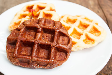 Fresh waffle on plate.