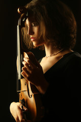 Woman with violin dark portrait of violinist musician