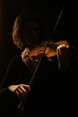 Violin player violinist. Orchestra musical instruments concert