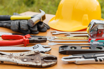 Fototapeta premium Closeup of assorted work tools on wood