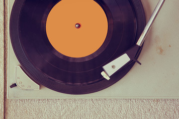 top view of old record player, image is retro filtered  