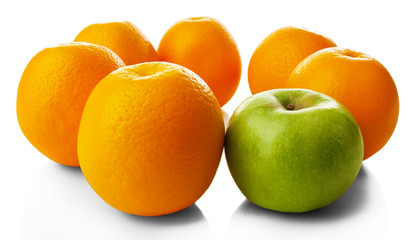Juicy oranges and apple, close-up