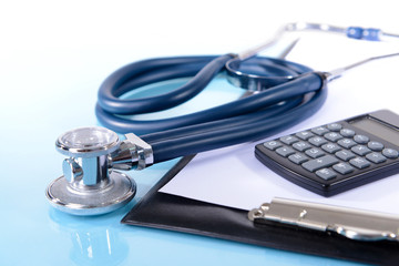 Stethoscope on light blue background