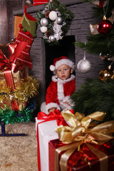 baby Santa Claus with Christmas gifts