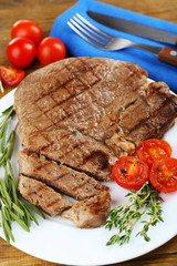 Delicious grilled meat on table