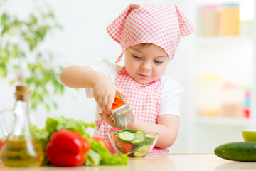 kid girl preparing vegetables