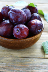 Ripe plums in a bowl