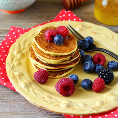 Homemade sweet pancakes with raspberries