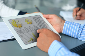 Image of human hand pointing at touchscreen