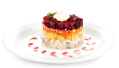 Russian herring salad on plate isolated on white