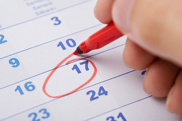 Hand Marking 17th Date On Calendar