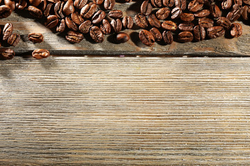 Coffee beans on wooden background