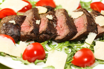 Grilled meat with tomatoes and cheese