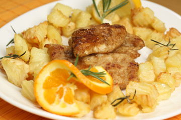 Delicious potatoes and meat with lemon