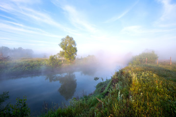 Naklejka na ściany i meble Foggy morning on the river