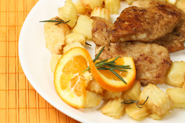 Delicious potatoes and meat with lemon