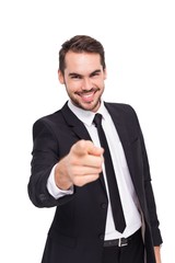 Happy businessman pointing at camera