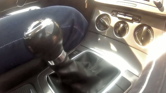 cars interior with driver  shifting gears