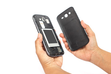 Hand holding smartphone and open backside cover isolated on whit