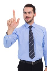 Happy businessman standing and pointing up
