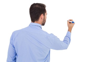 Rear view of a businessman writing with marker