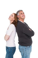 Casual couple smiling and looking up