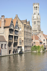 Fototapeta na wymiar View of the Belfort and one of the canals of Bruges (Belgium)