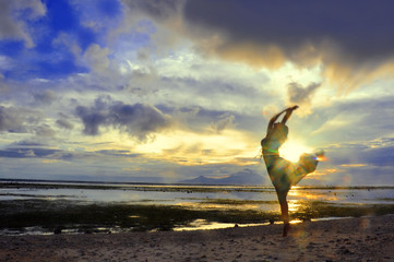 Woman dance at the Sunset over Bali as seen from Gili, Indonesia - obrazy, fototapety, plakaty