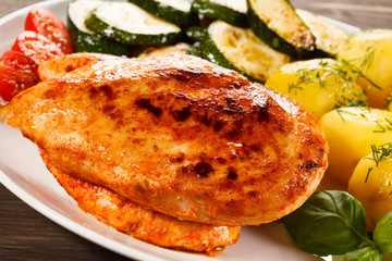 Fried chicken fillet, boiled potatoes and vegetable salad