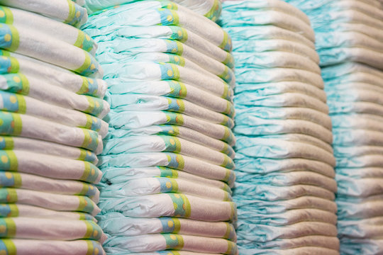 Children's diapers stacked in a piles