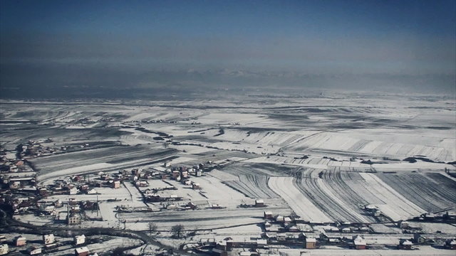 aerial view over small village in wintertime