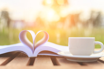 Close up book and Coffee cup on the table in the morning