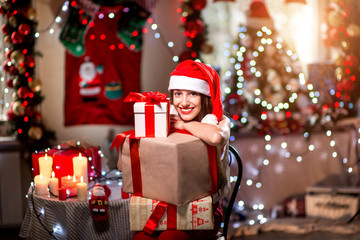 Fototapeta na wymiar Young woman with present box on Christmas