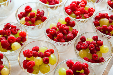 Fresh berry and grapes in cups