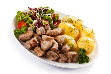 Grilled meat with boiled potatoes and vegetables