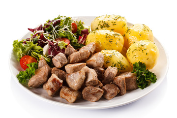 Grilled meat with boiled potatoes and vegetables