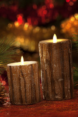 electric candles with christmas decorations in atmospheric light
