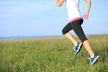 young fitness woman runner athlete running outdoor