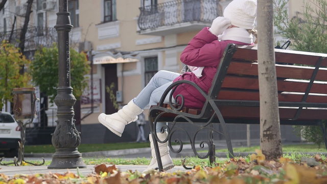 Bench on the street  at small town in autumn day