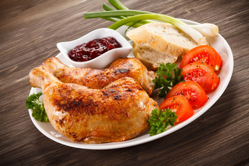 Grilled chicken drumsticks and vegetables