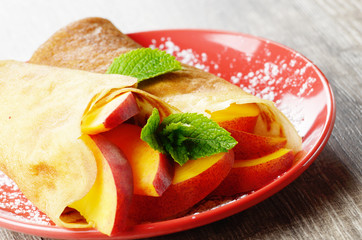Crepes with peaches