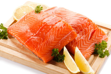 Fresh raw salmon fillet on cutting board