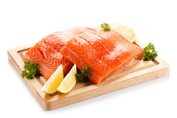 Fresh raw salmon fillet on cutting board