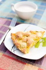 Piece of tasty biscuit apple pie and cup of hot cocoa