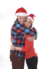Christmas young couple in Santa hats in love happy together