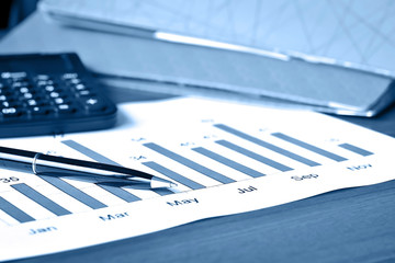 business graph report with pen 