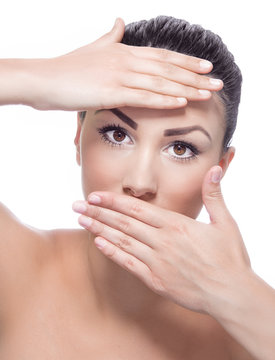 Young beauty woman covering her face with hands