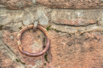 Obraz na płótnie Canvas Old metal ring in a rustic wall
