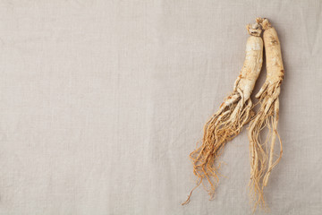 dry ginseng roots on the burlap - obrazy, fototapety, plakaty