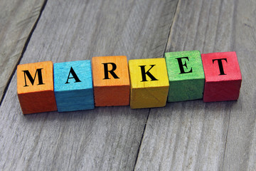 concept of market word on wooden colorful cubes
